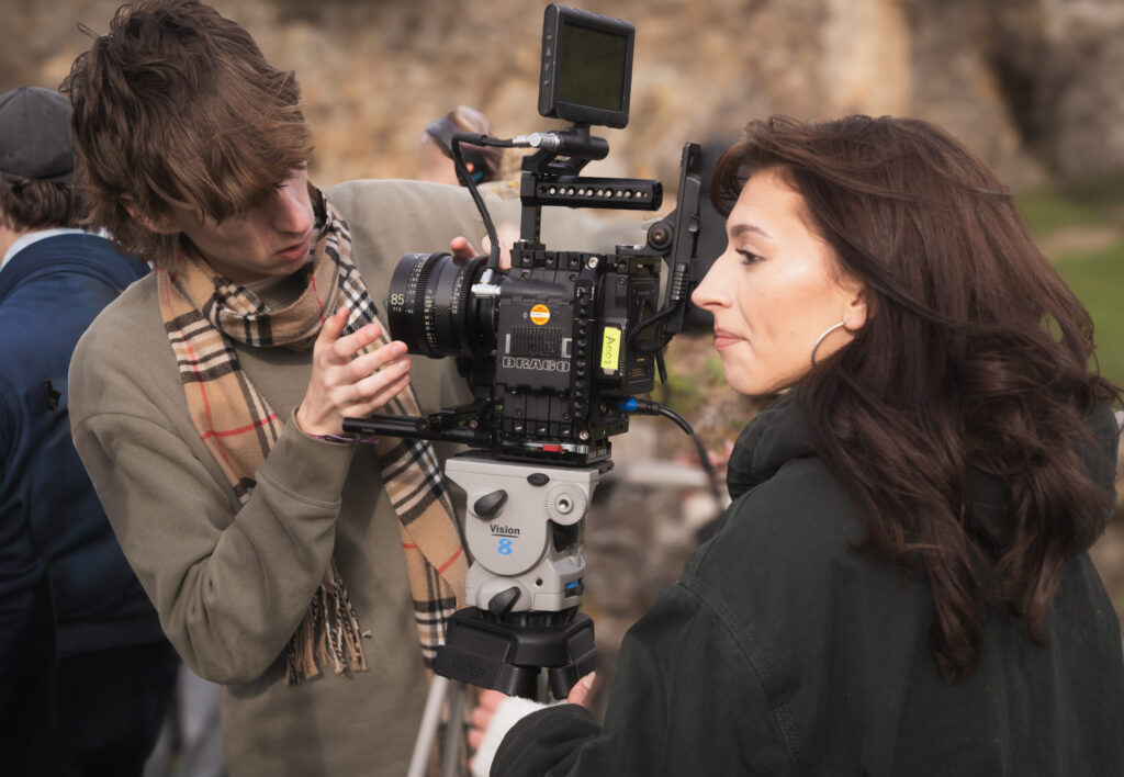 Image of a two young people with a film camera
